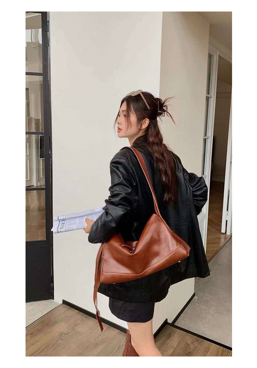 “Livia — Leather Bag in Rich Brown Shade”