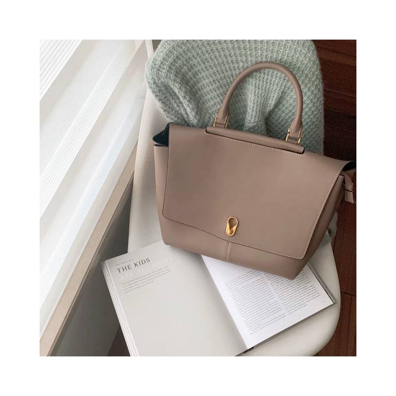 Elegant Leather Bag with Gold Hardware