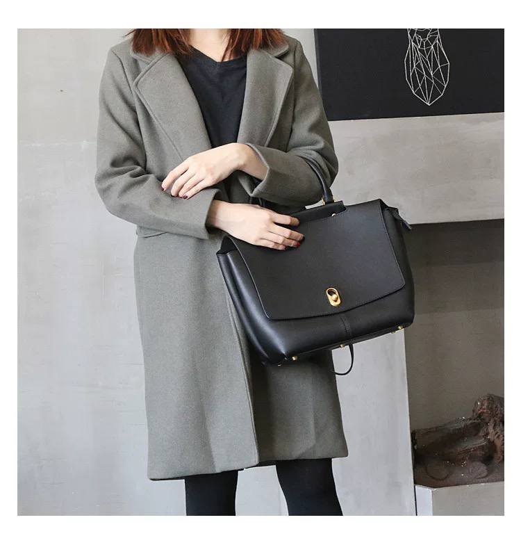 Elegant Leather Bag with Gold Hardware
