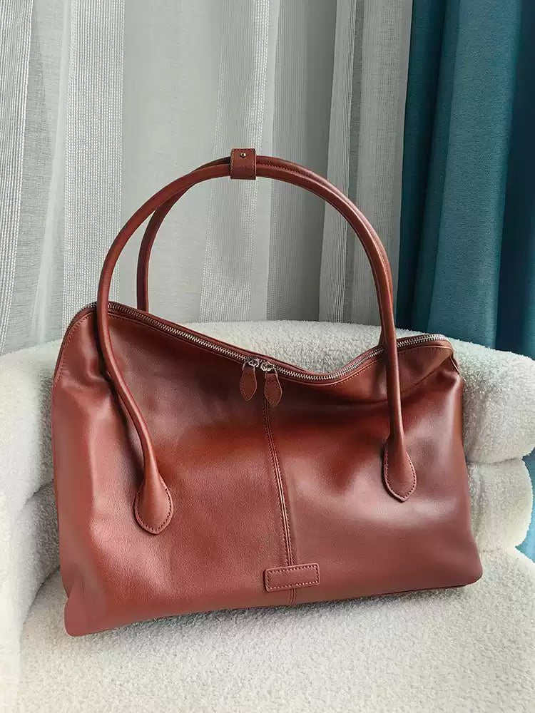 Executive Traveler — a large leather bag for business and travel.