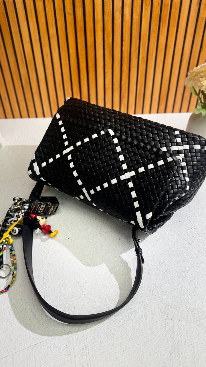 Artisan Weave-The Art of Handwoven Elegance — a handmade leather bag