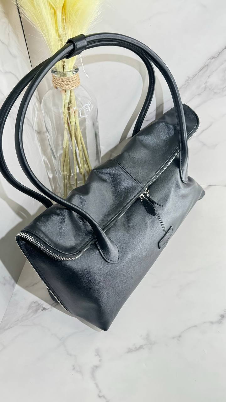 Executive Traveler — a large leather bag for business and travel.