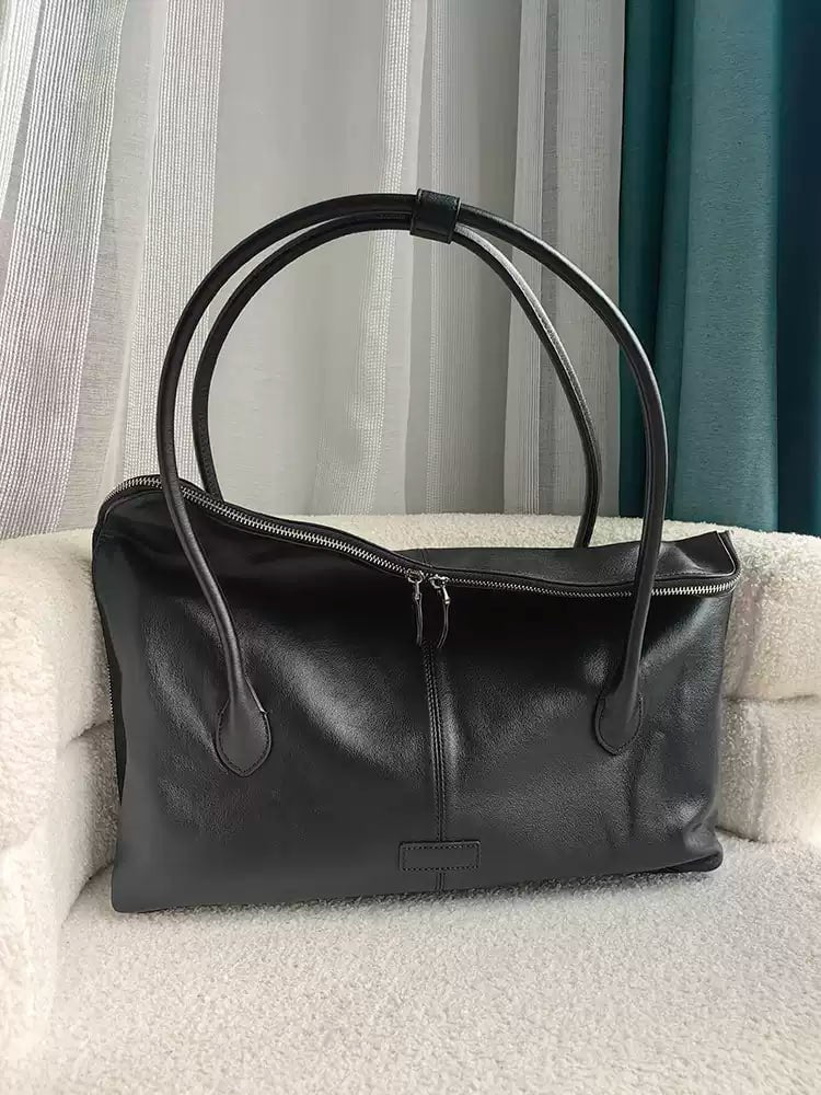 Executive Traveler — a large leather bag for business and travel.