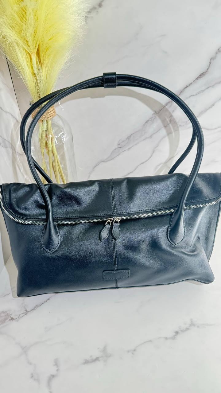 Executive Traveler — a large leather bag for business and travel.
