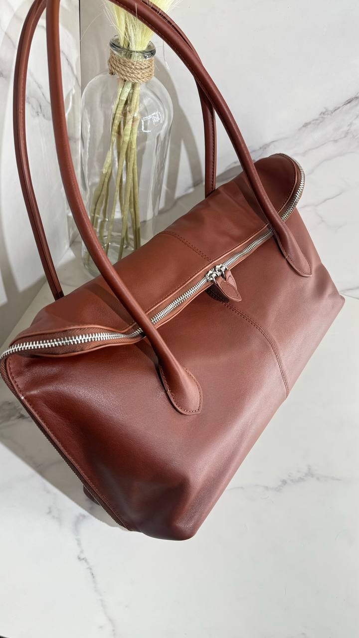 Executive Traveler — a large leather bag for business and travel.