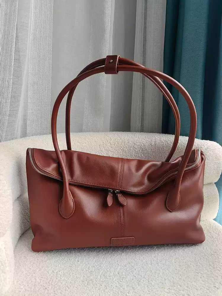 Executive Traveler — a large leather bag for business and travel.