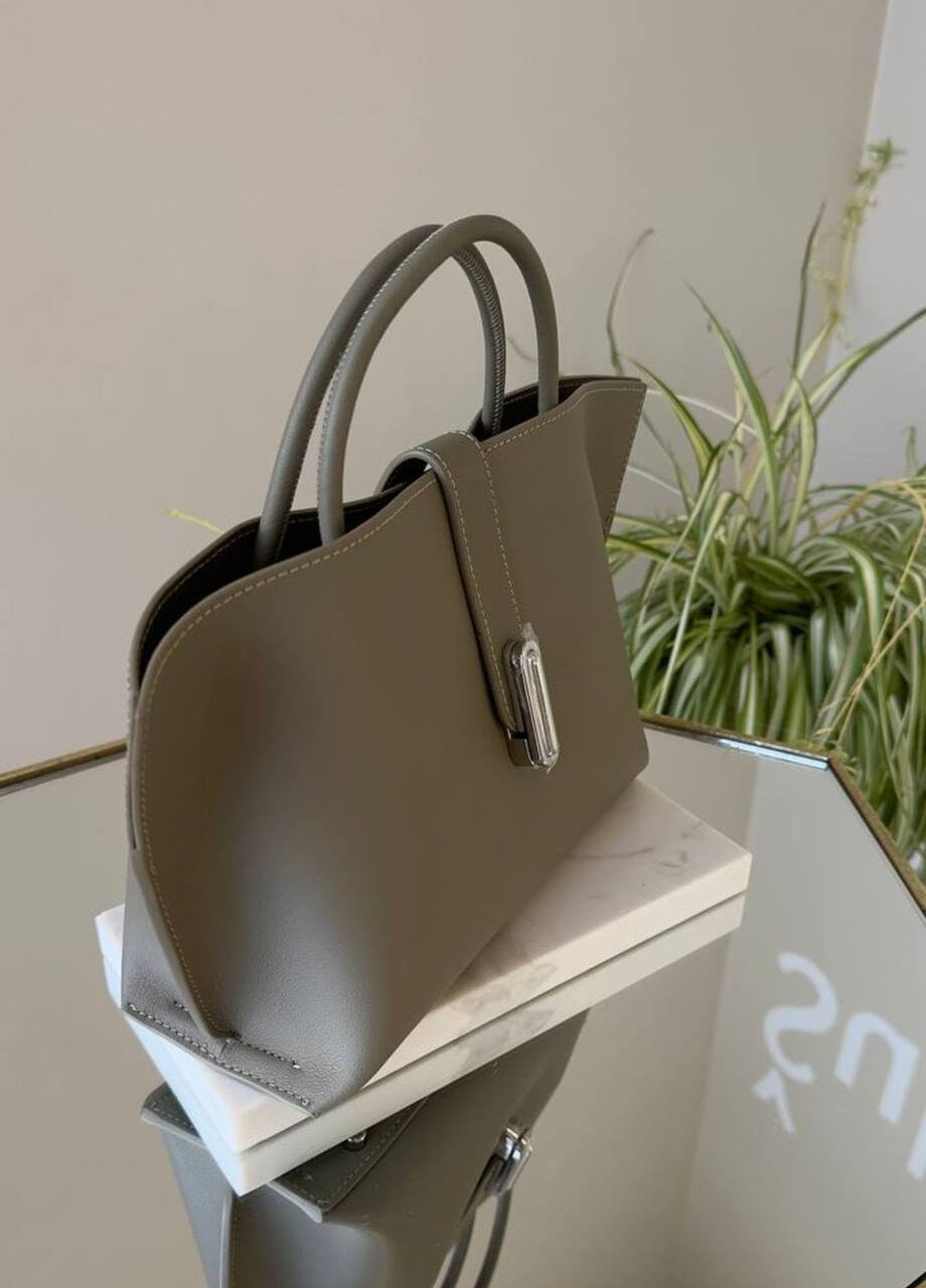 Elegant Suede Handbag with Faux Leather Accents and Detachable Strap