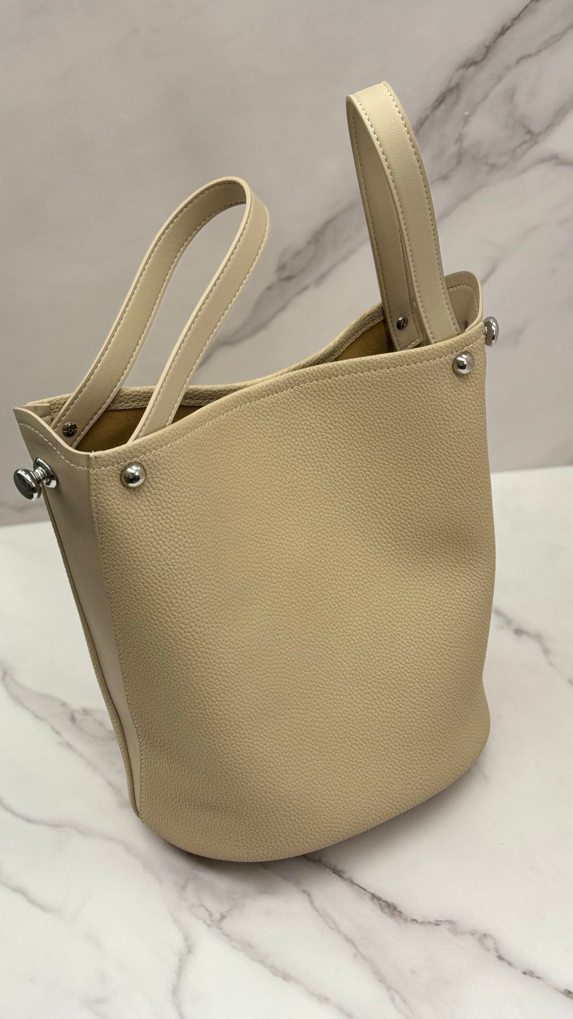 “Versatile” — leather bucket bag